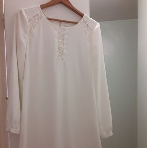 Long sleeve white dress with lace details